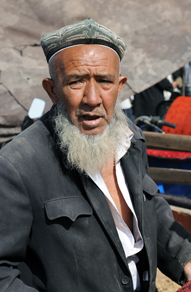 Vendeur de moutons, marché des animaux, Kashgar, Xinjiang, Chine