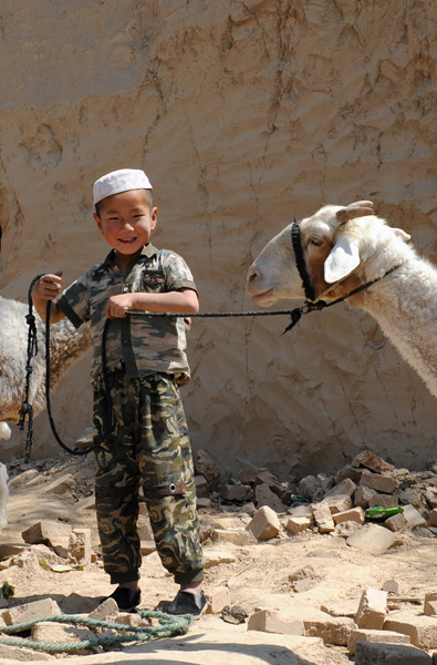 Jeune berger, district de Dongxiang, Chine