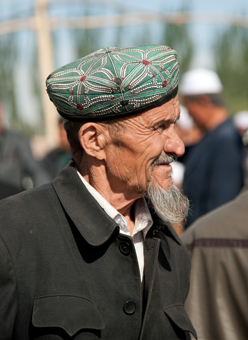 Berger ouïgour, marché des animaux, Kashgar, Xinjiang, Chine